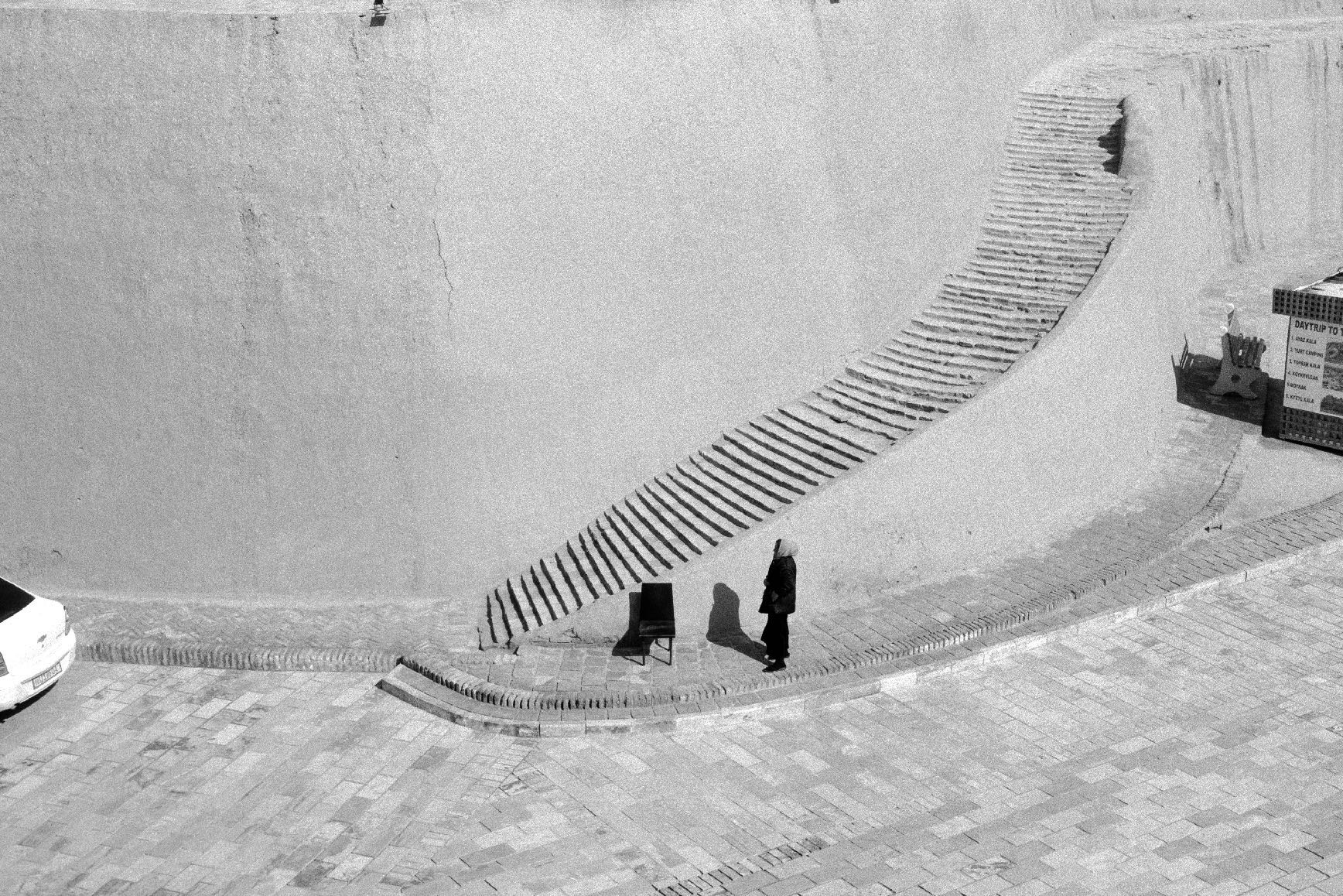 Black-and-white photograph: The watcher of the Stairs, Khiva, Uzbekistan, 2024